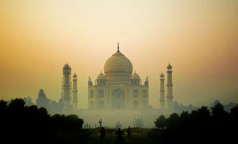 The Taj Mahal in Agra rising above morning mist