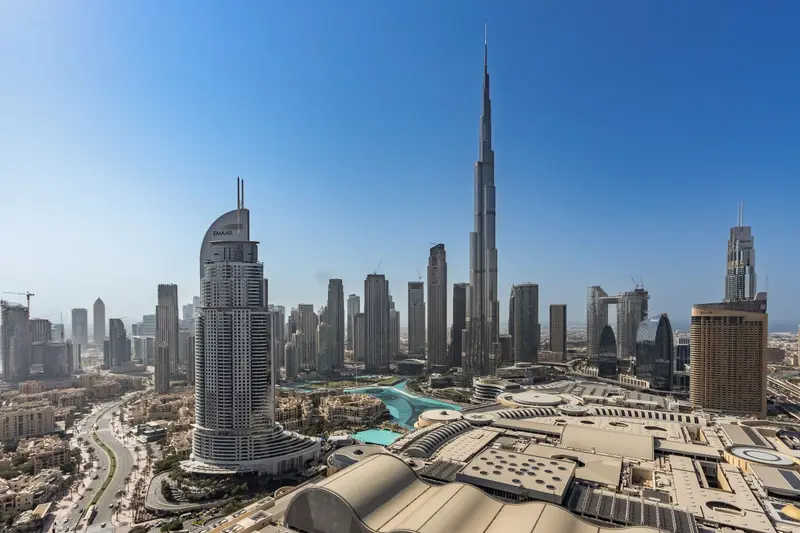 Downtown Dubai skyline with the Burj Khalifa under a blue sky