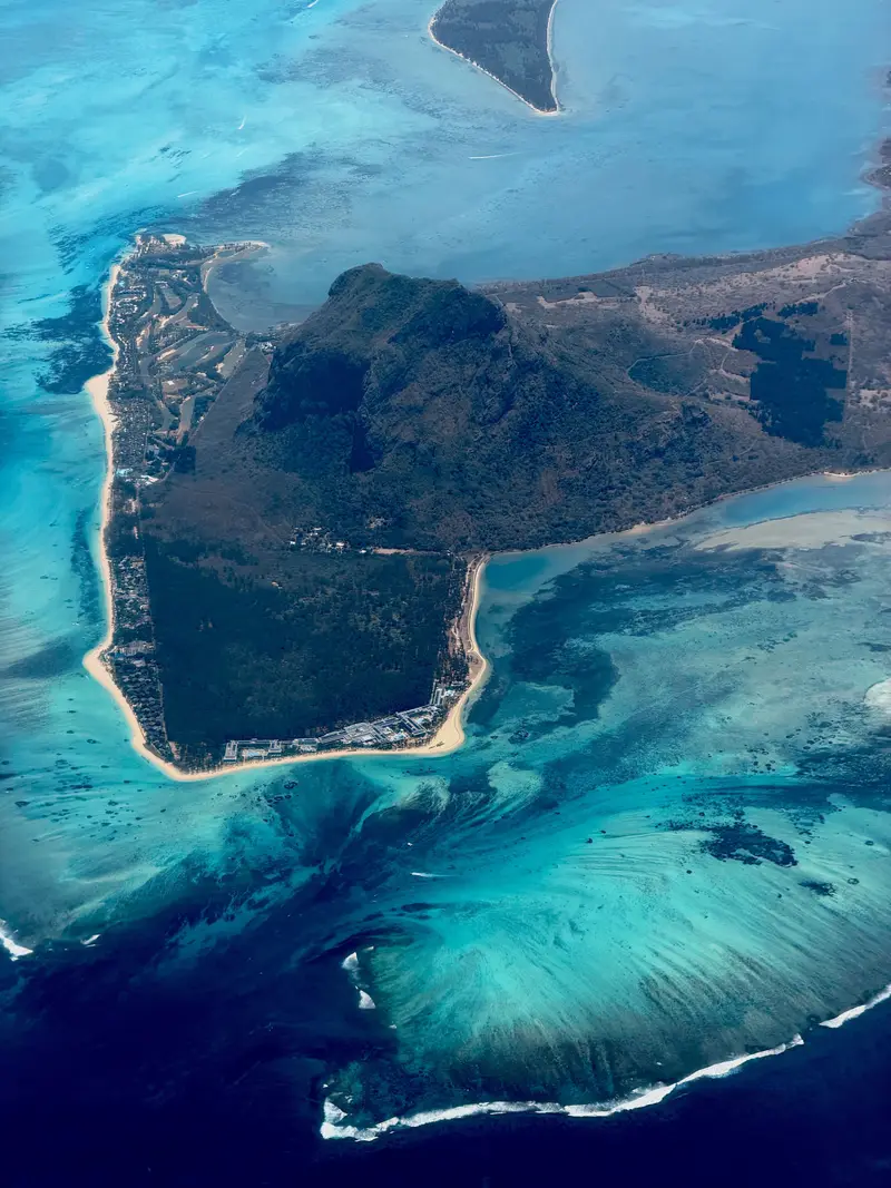 Aerial view of the Le Morne Brabant peninsula and turquoise lagoon, Mauritius