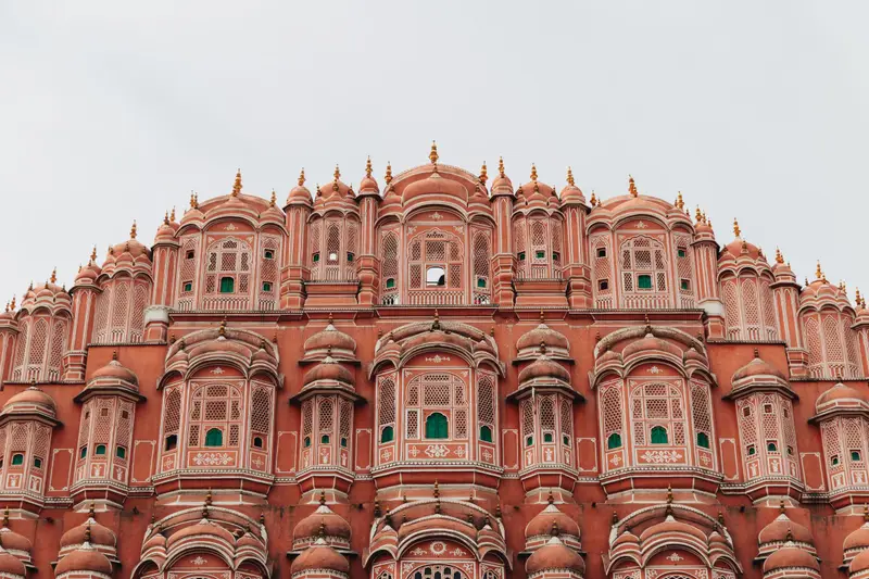 The pink sandstone facade of Hawa Mahal in Jaipur, Rajasthan