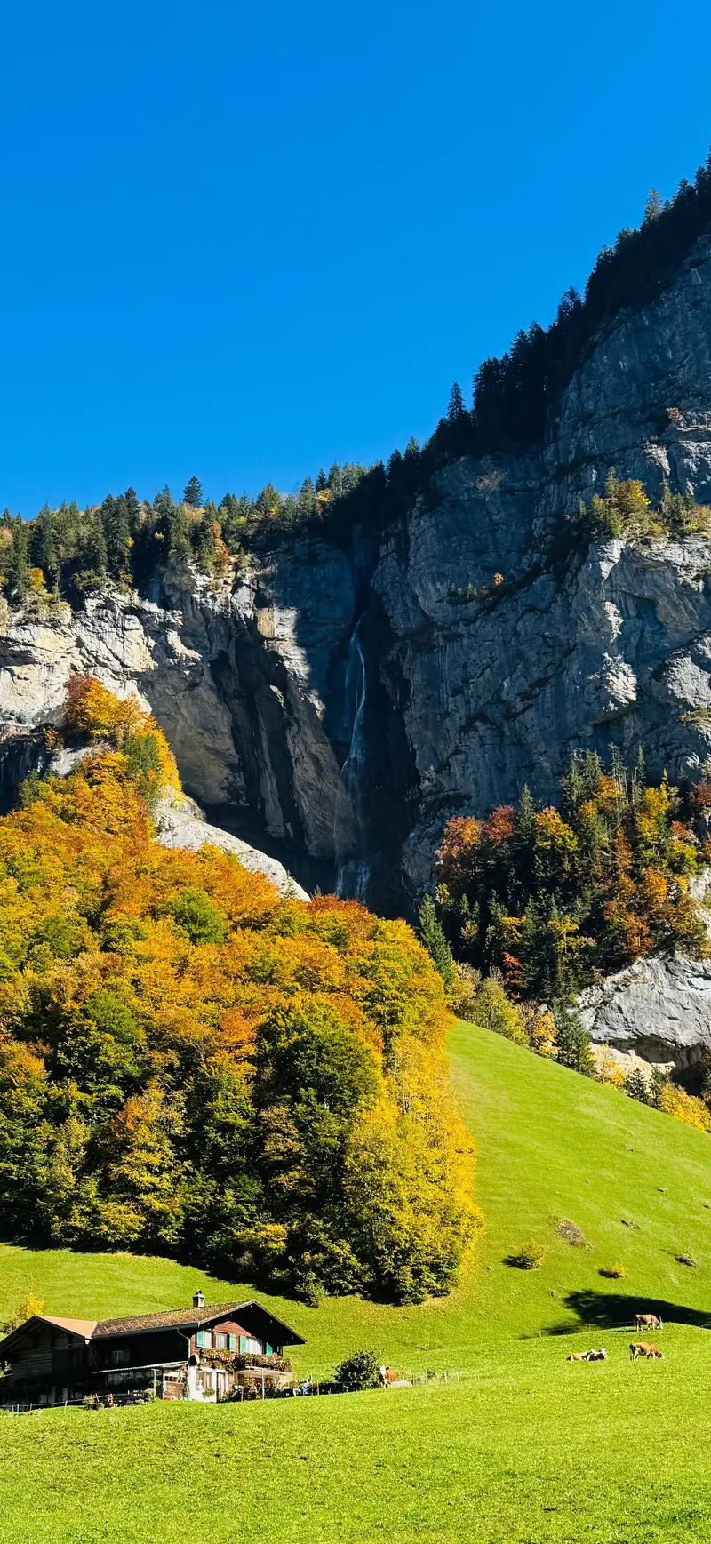 A waterfall dropping down the cliffs of the Lauterbrunnen Valley, Switzerland