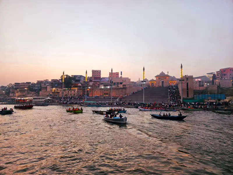 Boats on the Ganges in front of the Varanasi ghats at sunset